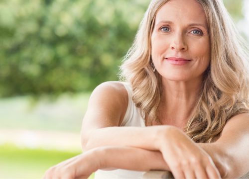 Older woman sitting outside