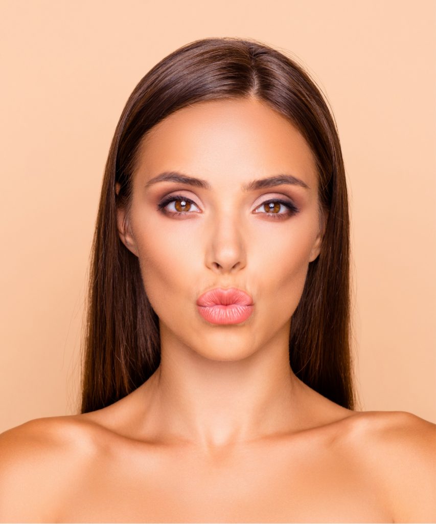 Woman puckering up her lips