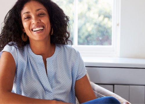 Happy woman wearing a blue blouse