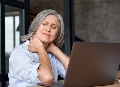 Middle age woman experiencing muscle aches