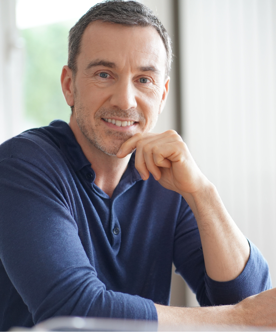Middle-age man wearing a blue shirt