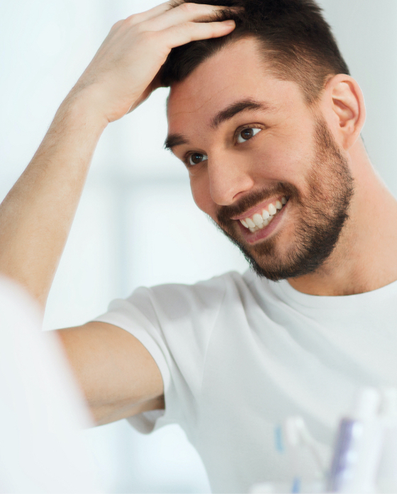 Man touching his hair