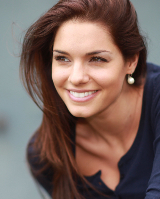 Brunette woman wearing gold earrings